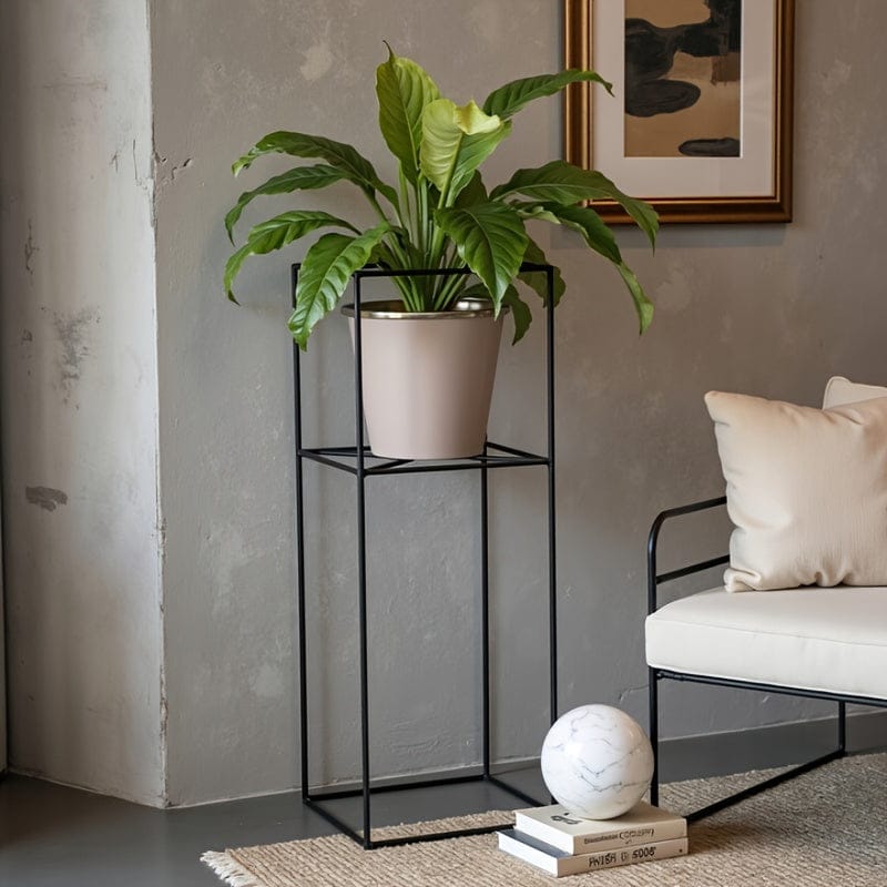 cache-pot sur pied noir et doré