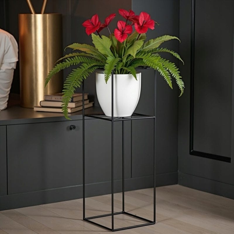 cache-pot sur pied noir et doré