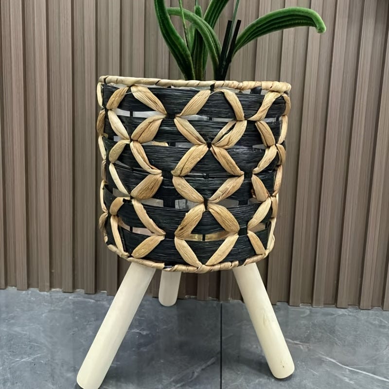 petit cache-pot sur pied noir tressé